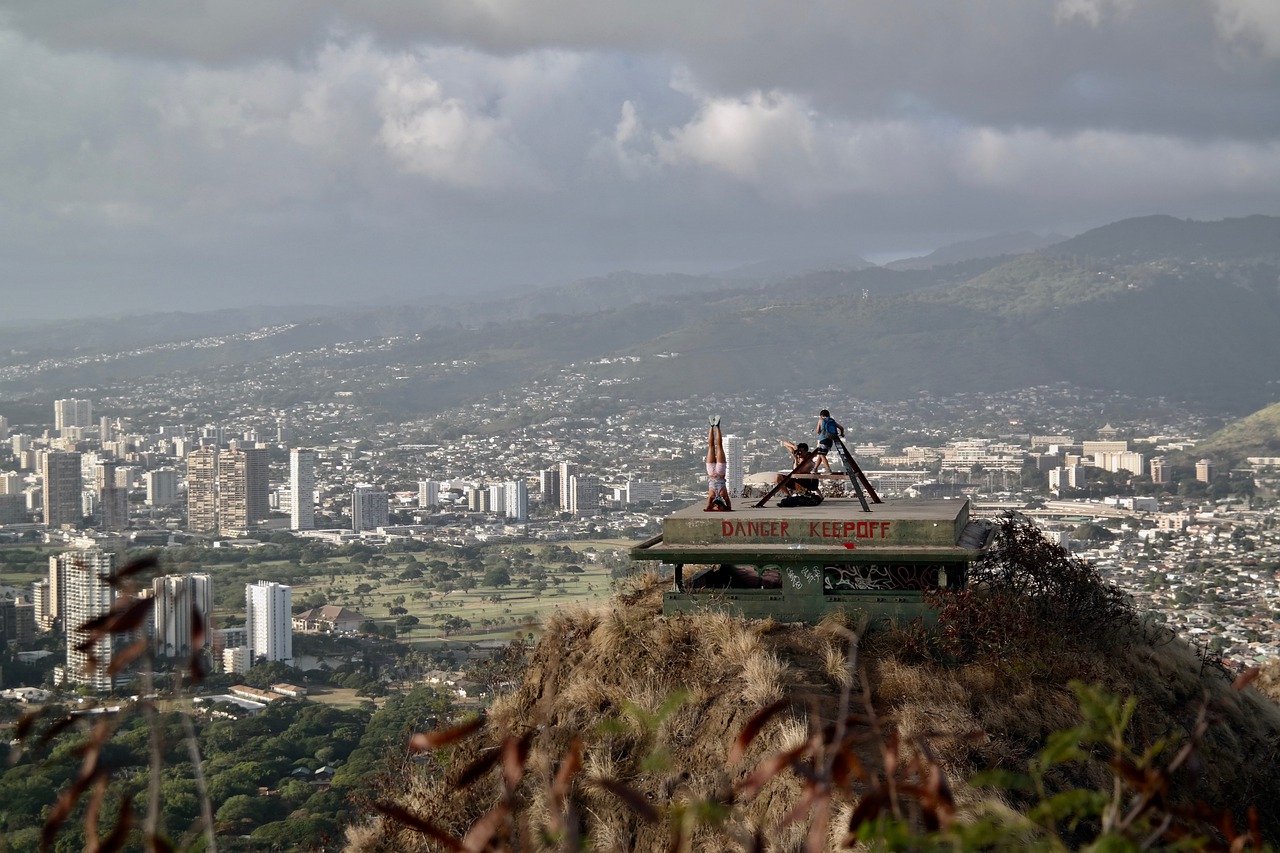 Individuals on a platform overlooking the city